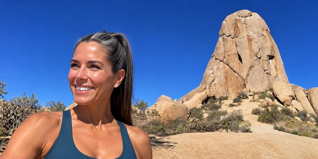 Hormone replacement therapy with Riovie — smiling woman on a desert hike