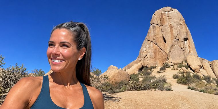 Smiling woman on a desert hike